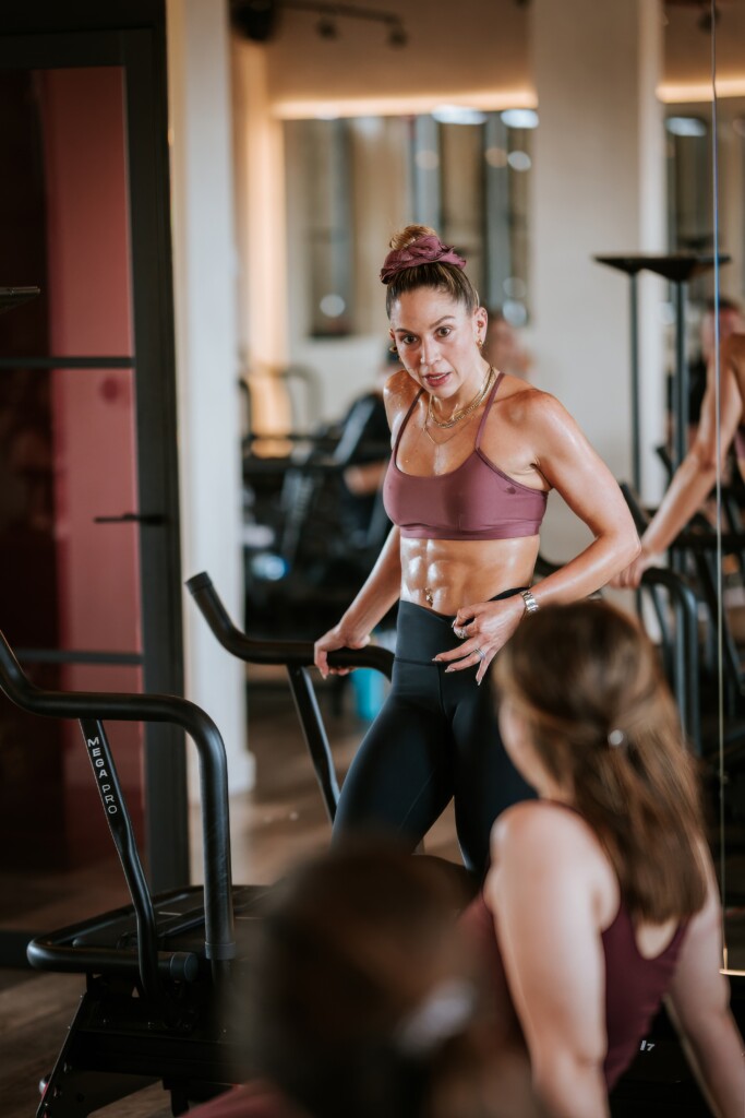 woman training at a gym - How Long Does It Take To See Results From Lagree