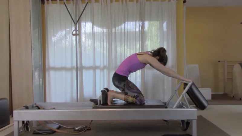 Pilates Reformer Moves Names - knee stretch round spinal