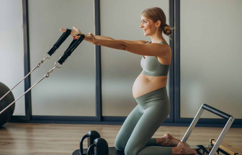Can You Do Reformer Pilates While Pregnant - standing on moving carriage